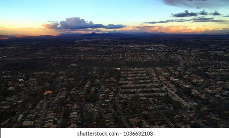 Birds Eye View, Aerial, Panoramic, Perspective Of Del Mar Heights, Rancho Santa Fe, And The Distant Hills Of North County San Diego California Under Cumulus Clouds During A Beautiful Sunset.