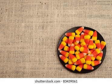 A Bird's Eye View Of Candy Corn In A Dish For Halloween Or Thanksgiving Themed Invitation Or Card With Area For Your Words