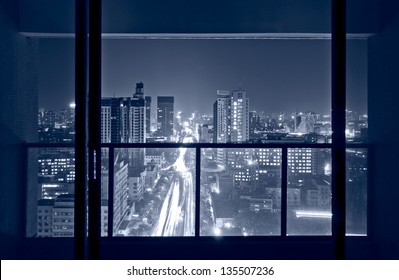 A Bird's Eye View Of The City Night View Outside The Window