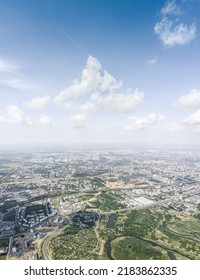 Birds Eye View Of Cityscape On Sunny Day. Residential Neighborhood Near Green Park. Vertical Aerial Panorama.