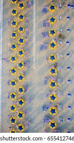 Bird's Eye View Of Colored Umbrella In A Beach In Italy
