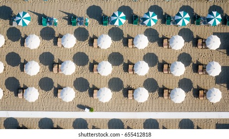 Bird's Eye View Of Colored Umbrella In A Beach In Italy
