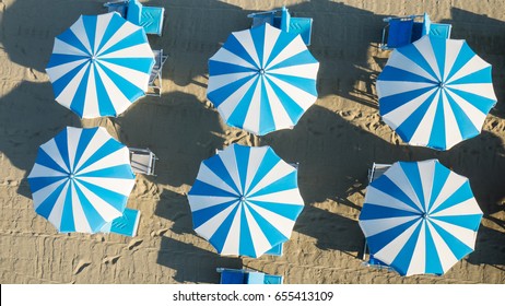 Bird's Eye View Of Colored Umbrella In A Beach In Italy
