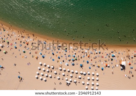 Similar – Aerial View From Flying Drone Of People Crowd Relaxing On Algarve Beach In Portugal