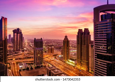 Bird's Eye View Of Dubai Downtown Buildings And Sheikh Zayed Road After Sunset