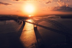 A Bird's Eye View Of Memphis Bridge Connecting Tennessee And Arkansas At Sunset Over The Mississippi River