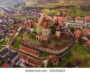 Birds eye view photography of a fortified church located in Romania, Biertan village. Drone shot of a medieval fortified church.