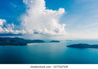 Bird's Eye View Of Picturesque Uninhabited Islands Surrounded By Pure Nature. Drone View, Beautiful Blue Sky With White Clouds. Breathtaking Scenery Landscape With Sea