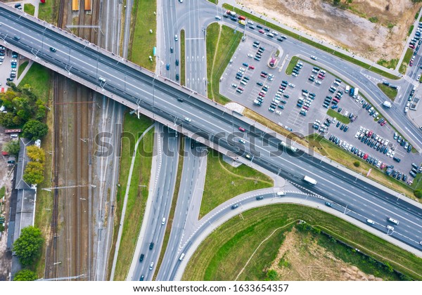 bird\'s eye view of a road\
bridge crossing a rail tracks. urban landscape. transportation\
background