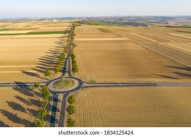 Bird's eye view of a roundabout in the middle of harvested grain fields in Rhineland-Palatinate / Germany