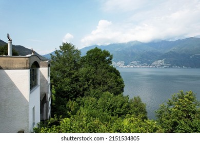 A bird's eye view of Sant Abbondio over Lago Maggiore lake and Locarno mountains in Ticino,Switzerland