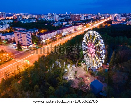 bird's eye view of the street and ferris wheel at sunset