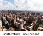 Birds perspective on the notorious city of Hillbrow, one of the most dangerous parts of Johannesburg in South Africa with the telephone tower in the centre in landscape format on a sunny day