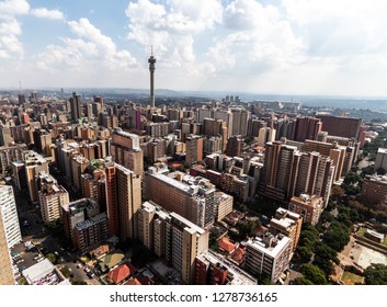 Birds Perspective On The Notorious City Of Hillbrow, One Of The Most Dangerous Parts Of Johannesburg In South Africa With The Telephone Tower In The Centre In Landscape Format On A Sunny Day