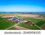 birds view of a farm and empty fields in autumn