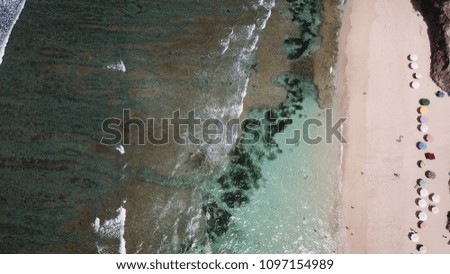 Similar – Luftpanorama-Drohne Blick auf die Meereswellen, die am felsigen Strand erdrücken.