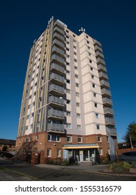 Birkenhead, UK - Nov 8, 2019: An Urban Tower Block Of Social Housing In The UK, Against A Blue, Cloudless Sky.