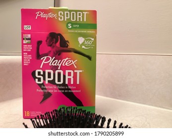 Birmingham, AL / USA - August 4, 2020: Opened Box Of Playtex Sport Tampons Offering 360 Degree Protection. Pink And Green Box.