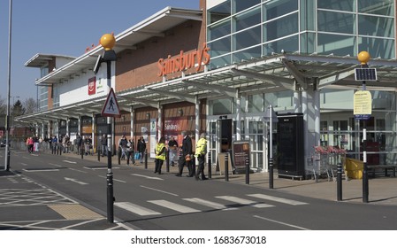 BIRMINGHAM, UK - 2020: Sainsburys Supermarket With Social Distancing Queue During The Coronavirus Pandemic