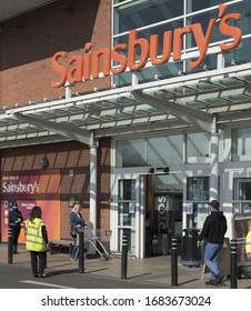 BIRMINGHAM, UK - 2020: Sainsburys Supermarket With Social Distancing Queue During The Coronavirus Pandemic