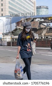 BIRMINGHAM, UK - 2020: Tesco Shopper With Bag And Mask At Birmingham  Grand Central Train Station During Coronavirus Pandemic