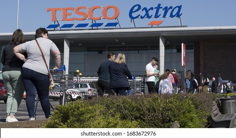 BIRMINGHAM, UK - 2020: Tesco Supermarket With Social Distancing Queue During The Coronavirus Pandemic