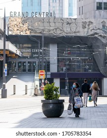 BIRMINGHAM, UK - 2020: A Woman Wearing A Mask At Grand Central Station In Birmingham City Centre During Coronavirus Pandemic