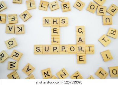 Birmingham, UK - December 2018: Scrabble Letters Spelling NHS, Help, Support, Care