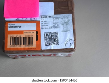 Birmingham UK, December 2019: Royal Mail Parcel Signed For With Stickers.