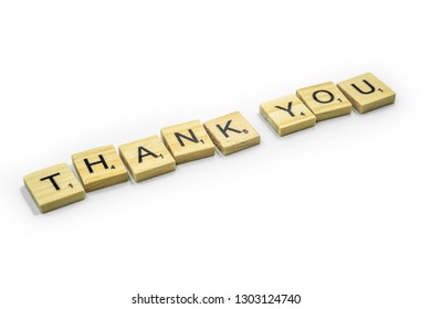 Birmingham, UK - February 2019: Scrabble Letters Spelling ‘Thank You’ On A White Background