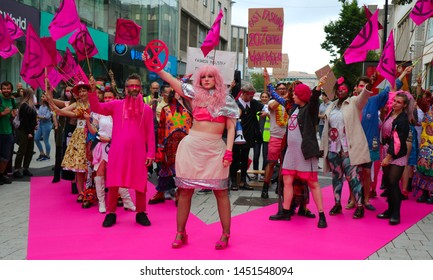 Birmingham, UK - July 13th 2019: Extinction Rebellion Protest Against Fast Fashion. Fashion Show Outside Primark