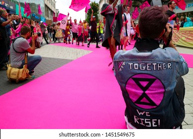 Birmingham, UK - July 13th 2019: Extinction Rebellion Protest Against Fast Fashion. Fashion Show Outside Primark