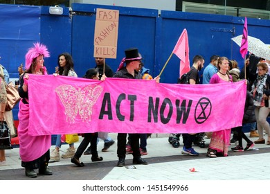 Birmingham, UK - July 13th 2019: Extinction Rebellion Protest Against Fast Fashion. Fashion Show Outside Primark