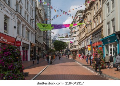 Birmingham, UK, July 27, 2022 - Tourists and locals walk among the shops in Birmingham City Centre during the 2022 Birmingham Commonwealth Games.