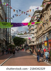 Birmingham, UK, July 27, 2022 - Tourists and locals walk among the shops in Birmingham City Centre during the Birmingham Commonwealth Games 2022.