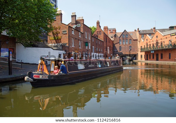 Birmingham, UK: June 29, 2018: Regency Wharf at Gas\
Street Basin.The restored canal system in Birmingham central is a\
national heritage landmark and where the Worcester and Birmingham\
canals meet. 