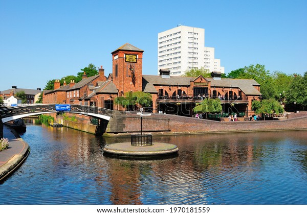 Birmingham, UK – June 29, 2019 - Old Turn\
Junction, or Deep Cutting Junction where the Birmingham and Fazeley\
Canal meets the Birmingham Canal Navigation\'s Main Line Canal,\
Birmingham, England