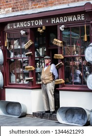 Birmingham, United Kingdom - July 14 2017: Shopkeeper Of A Vintage Hardware Store In Black Country Museum Standing In The Doorway.