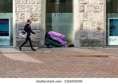 Birmingham,England,UK, March 23rd 2017. Homeless Person Sleeps Under Pile Of Bedding Covers On A Winters Day In The City Of Birmingham,Homelessness Is A Growing Social Problem In The UK.