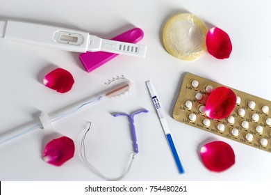 Birth Control symbol- IUD and contraceptive Pills and Condomon white 