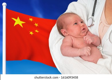 Birth Rate In China. Newborn Baby In Hands Of Doctor On National Flag Background.