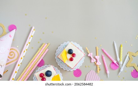 Birthday attributes: birthday cake pieces, candles, photo shoot accessories - Shutterstock ID 2062584482