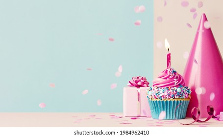 Birthday Background With Pink Birthday Cupcake And Candle, Birthday Gift And Party Hat