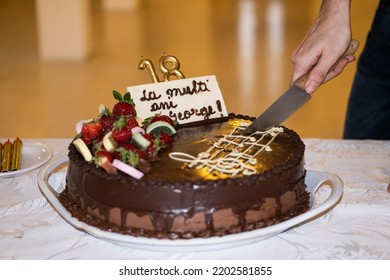 Birthday Cake Being Sliced With A Knife