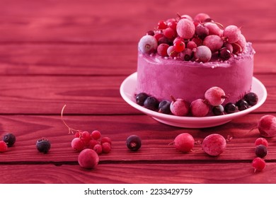 birthday cake with berries on wooden table in trendy color of year 2023 - Shutterstock ID 2233429759
