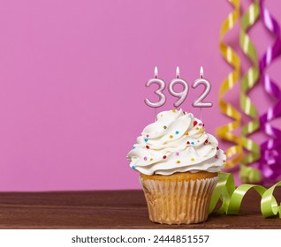 Birthday Cake With Candle Number 392 - On Pink Background.