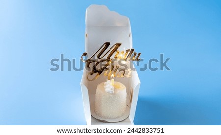 birthday cake and candle on blue background