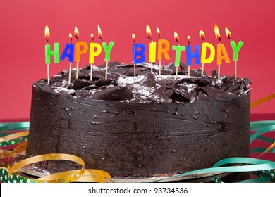 Birthday Cake With Birthday Candles Isolated On Red