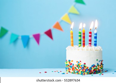 Birthday cake with colorful candles - Shutterstock ID 552897634