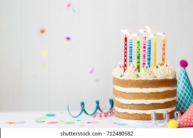 Birthday Cake With Colorful Candles At A Birthday Party